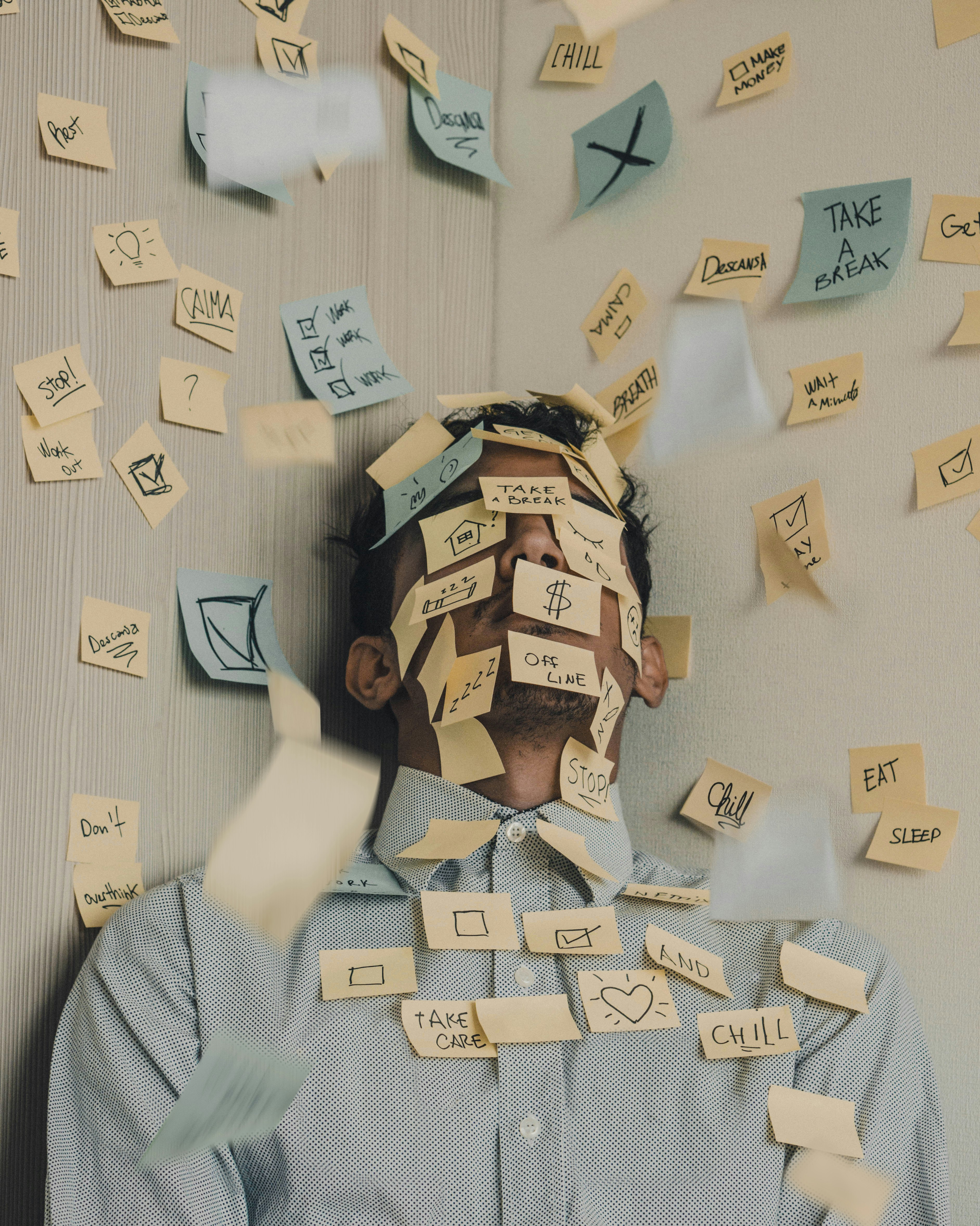 Person feeling overwhelmed by racing thoughts and overthinking, representing anxiety, worry, and rumination.